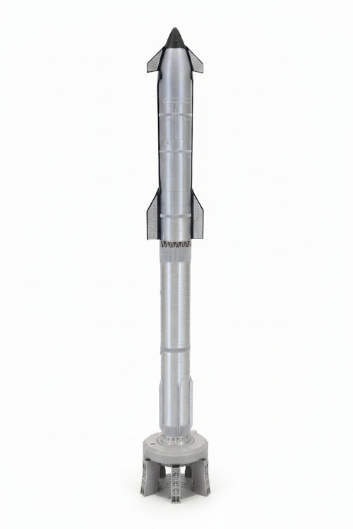 A silver and gray plastic toy model rocket standing upright on a small gray base against a plain white background.